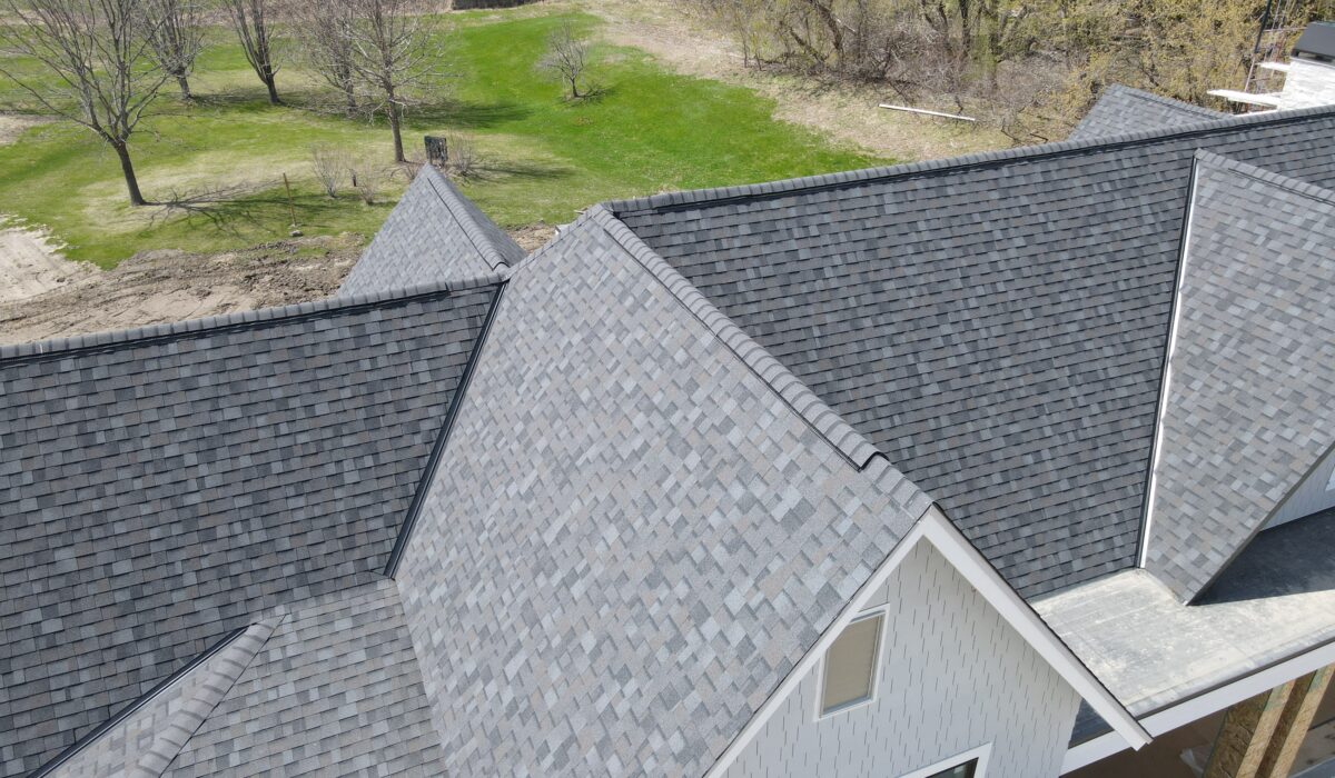 Overhead shot of new home roofing project using high-performance shingles.
