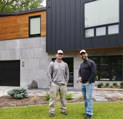 Allied Construction team members standing in front of completed modern home