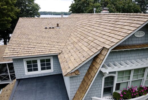 Side roof detail showing Brava shakes and dormer transitions.